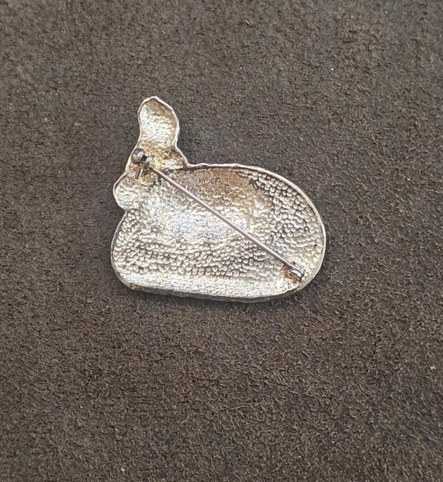 Silver-tone brooch back with pin and clasp, textured metal heart shape