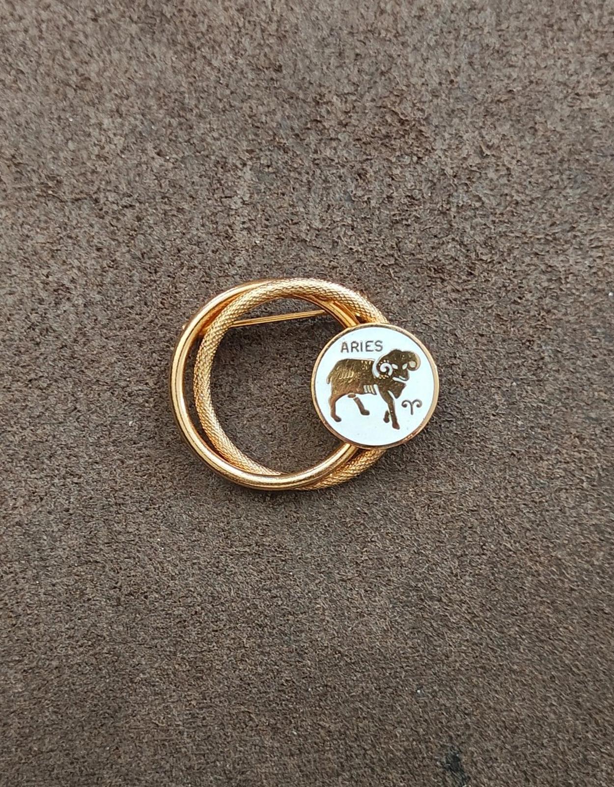 1970s Gold Tone Aries Zodiac Sign Double Circle White Enamel Brooch Pin