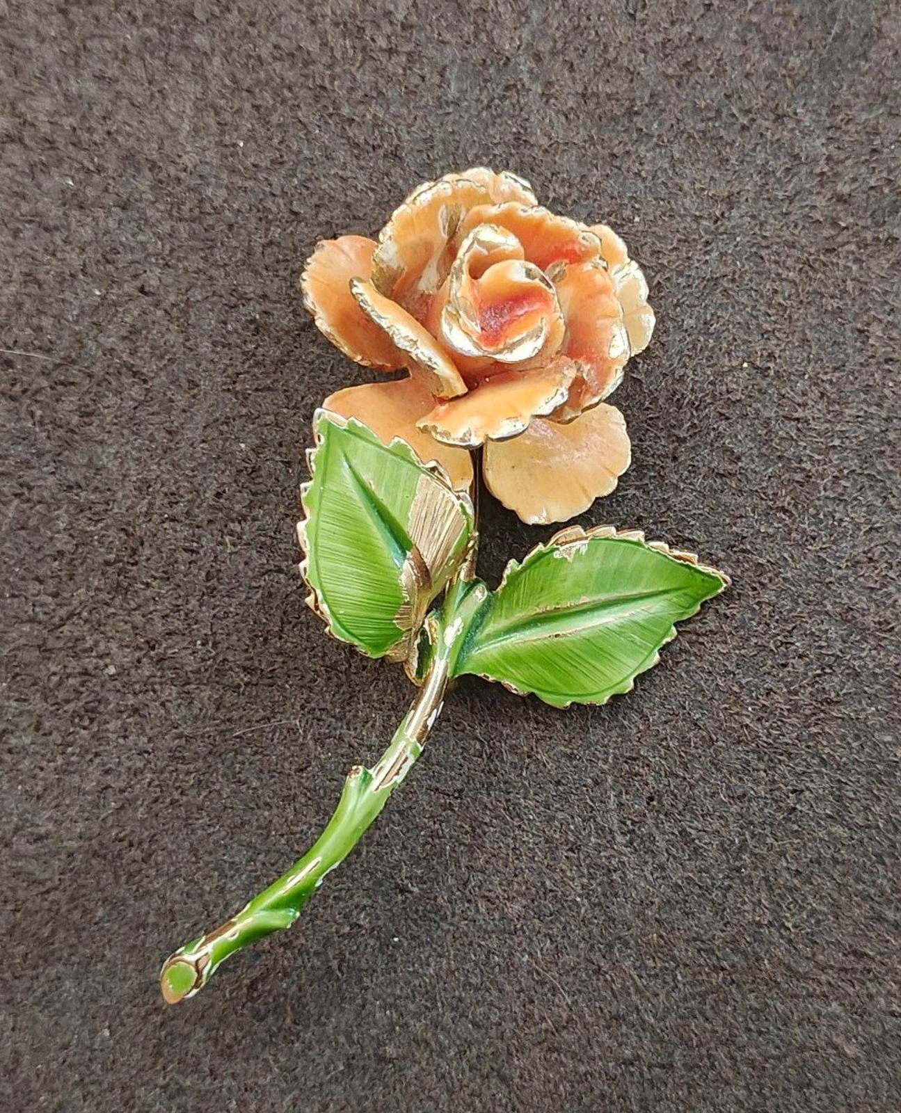 Gold-tone enamel rose and leaf pin, orange petals with green leaves and curved stem