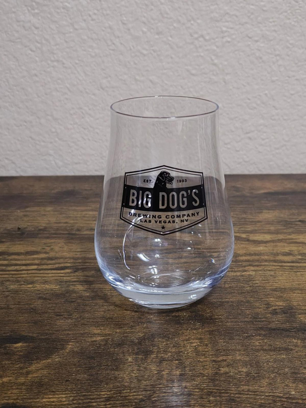 Clear stemless wine/beer glass with Big Dog's Brewing Company logo centered on front