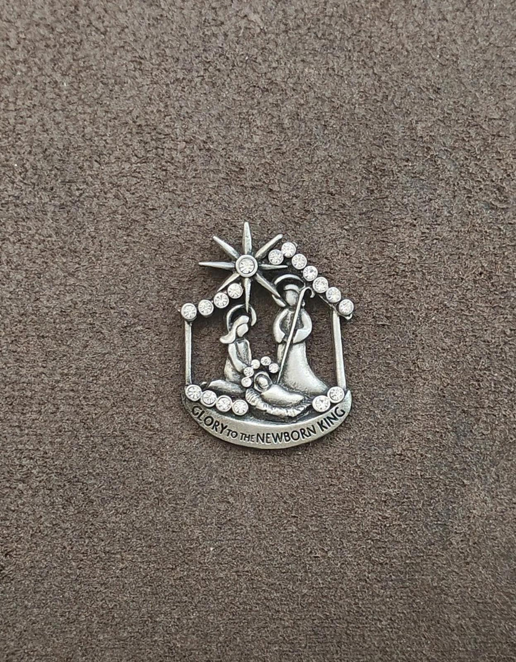 Silver nativity brooch with rhinestone star and angel figure details