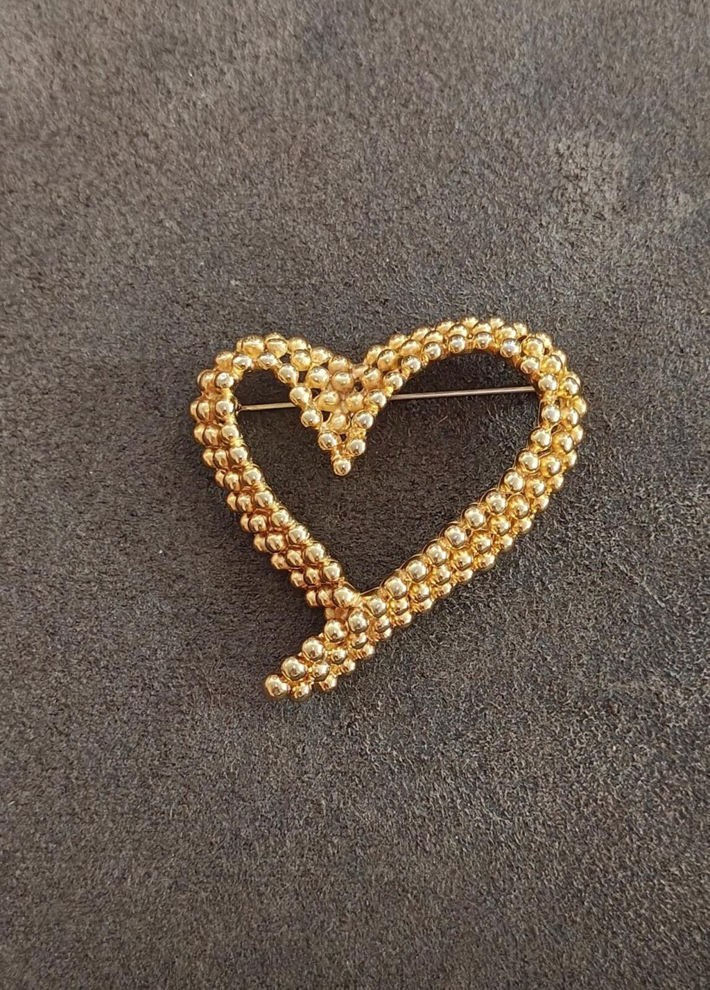 Gold-tone beaded heart brooch, centered heart outline with openwork center