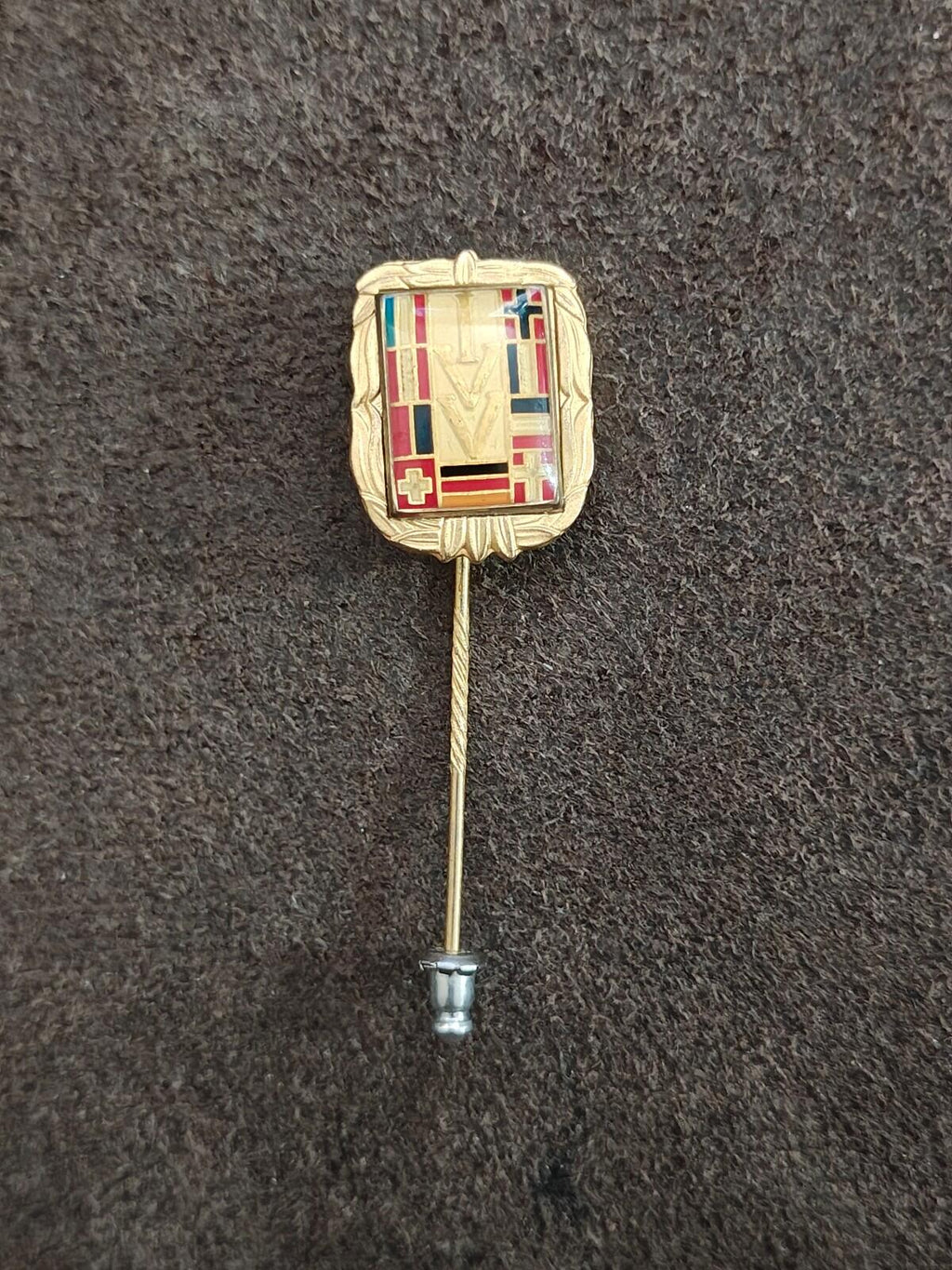 Gold-tone enamel hiking badge pin with multicolor crest and straight stick pin