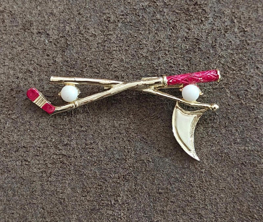 Golf club and flag lapel pin, gold-tone with red enamel ends and two white balls