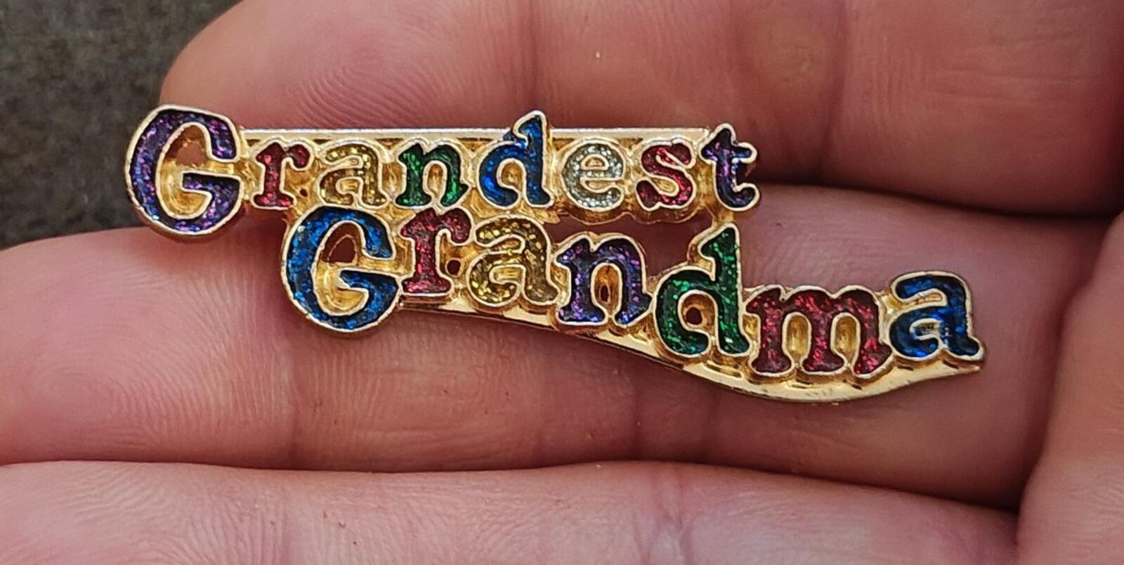 Grandma enamel brooch with gold-tone border and 'Grandest Grandma' script