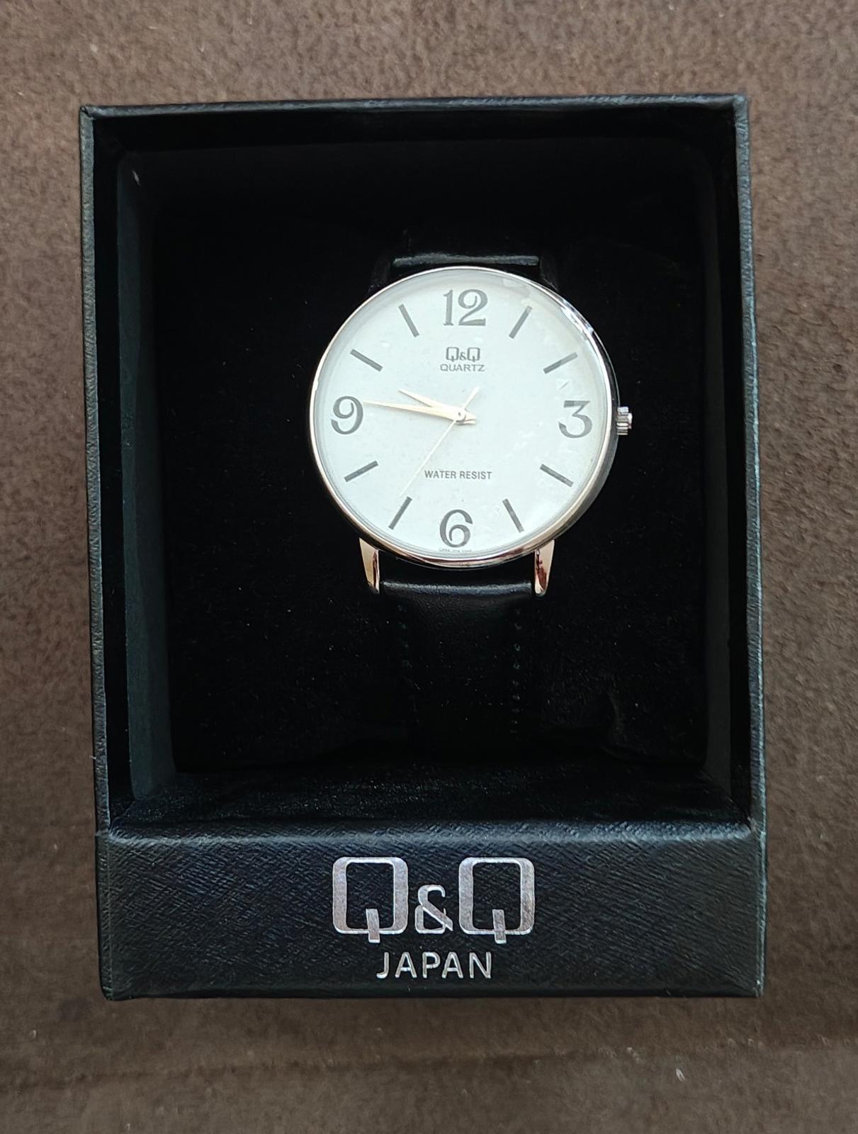 Q&Q Men's Analog Wrist Watch With White Dial and Black Leather Band.