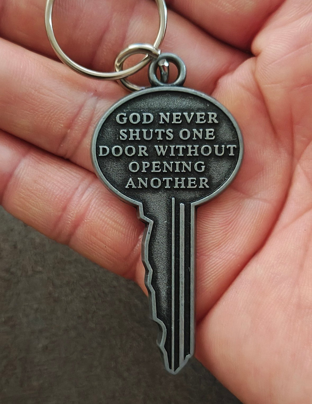 "God never shuts one door without opening another." Cast Metal Keychain