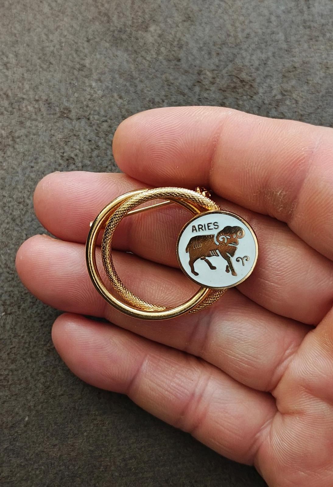 1970s Gold Tone Aries Zodiac Sign Double Circle White Enamel Brooch Pin