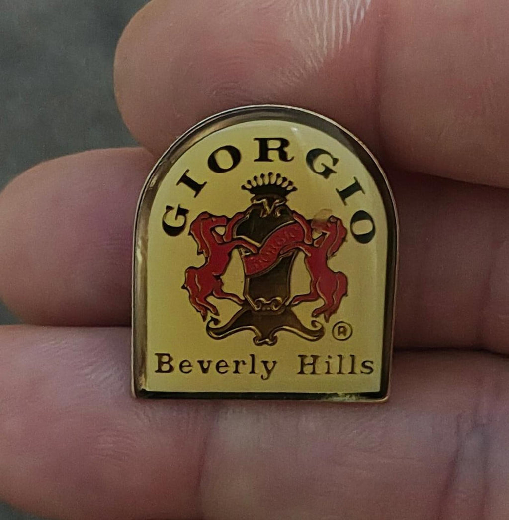 Gold-tone enamel crest pin with red and black lion, "Beverly Hills" text