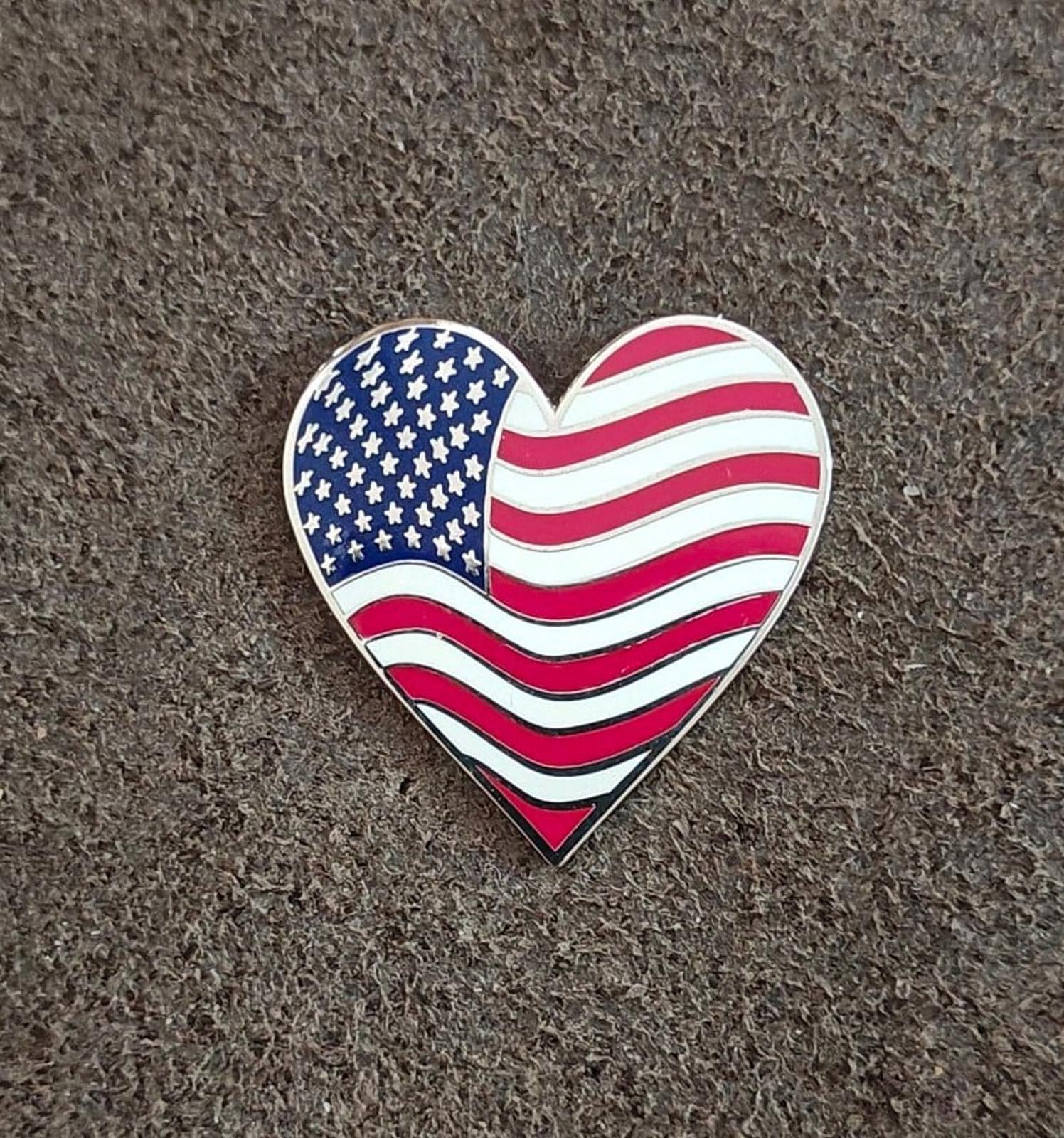 Heart-shaped enamel American flag pin, blue star section with red/white wavy stripes