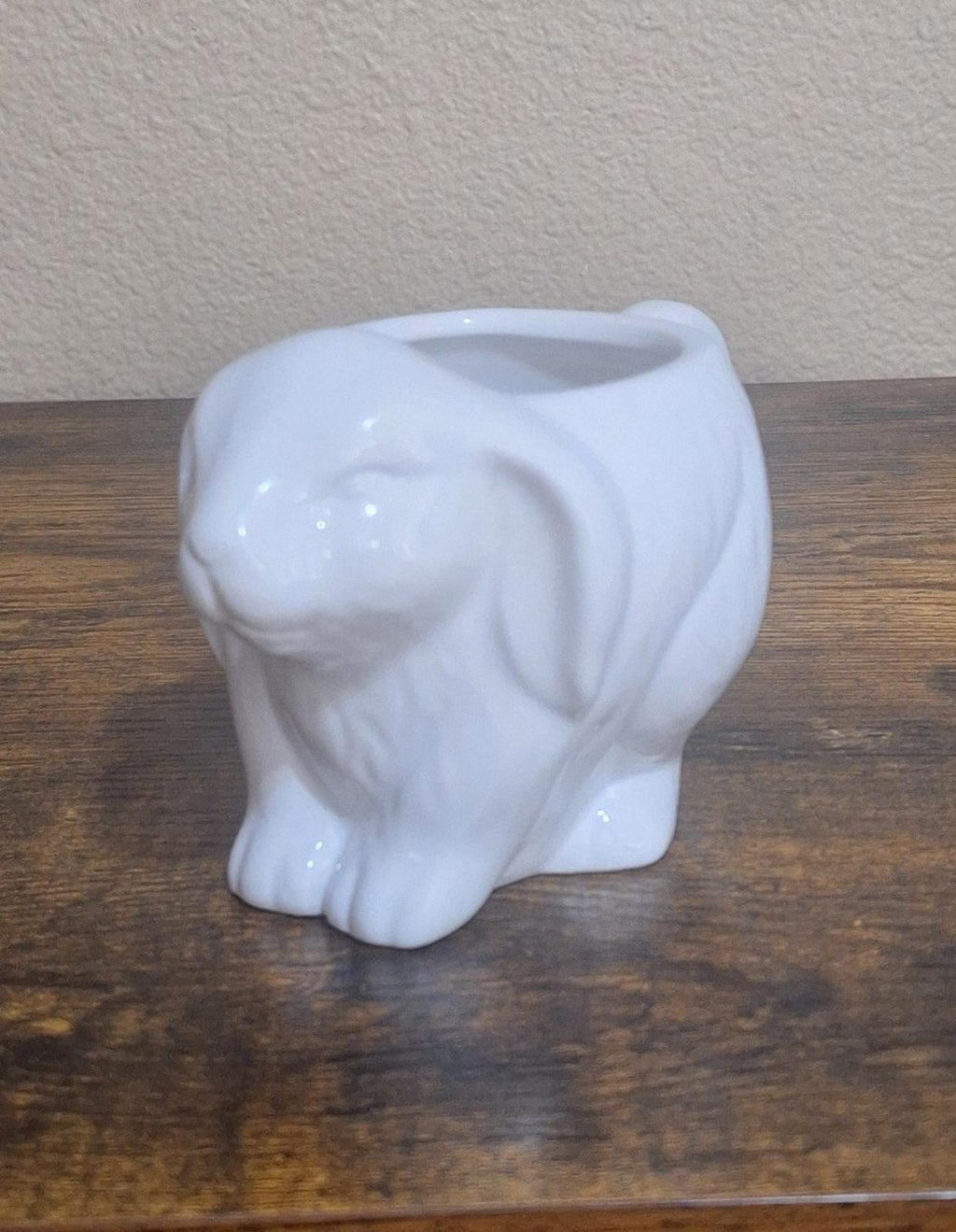 White ceramic bunny mug, front-left view, embossed rabbit body