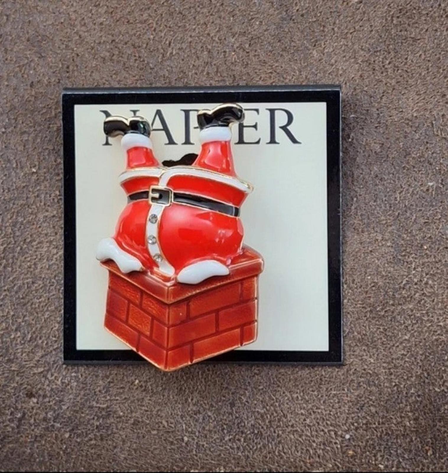 Red enamel Santa climbing down chimney pin on card, full card centered