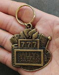 Gold slot machine-style keychain with 7777 and Bally’s Las Vegas text