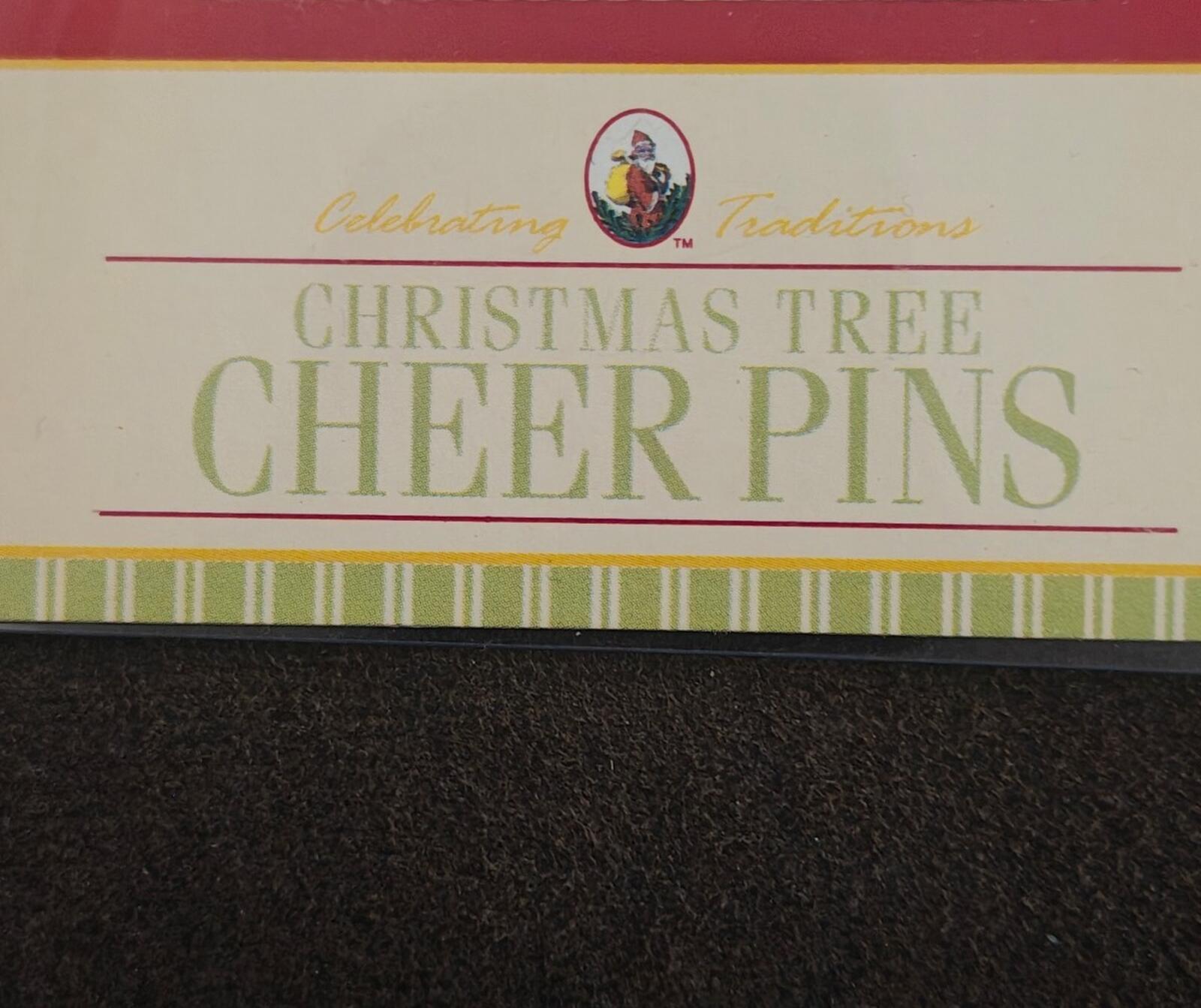 Christmas tree cheer pins title text on pin card, green and red lettering