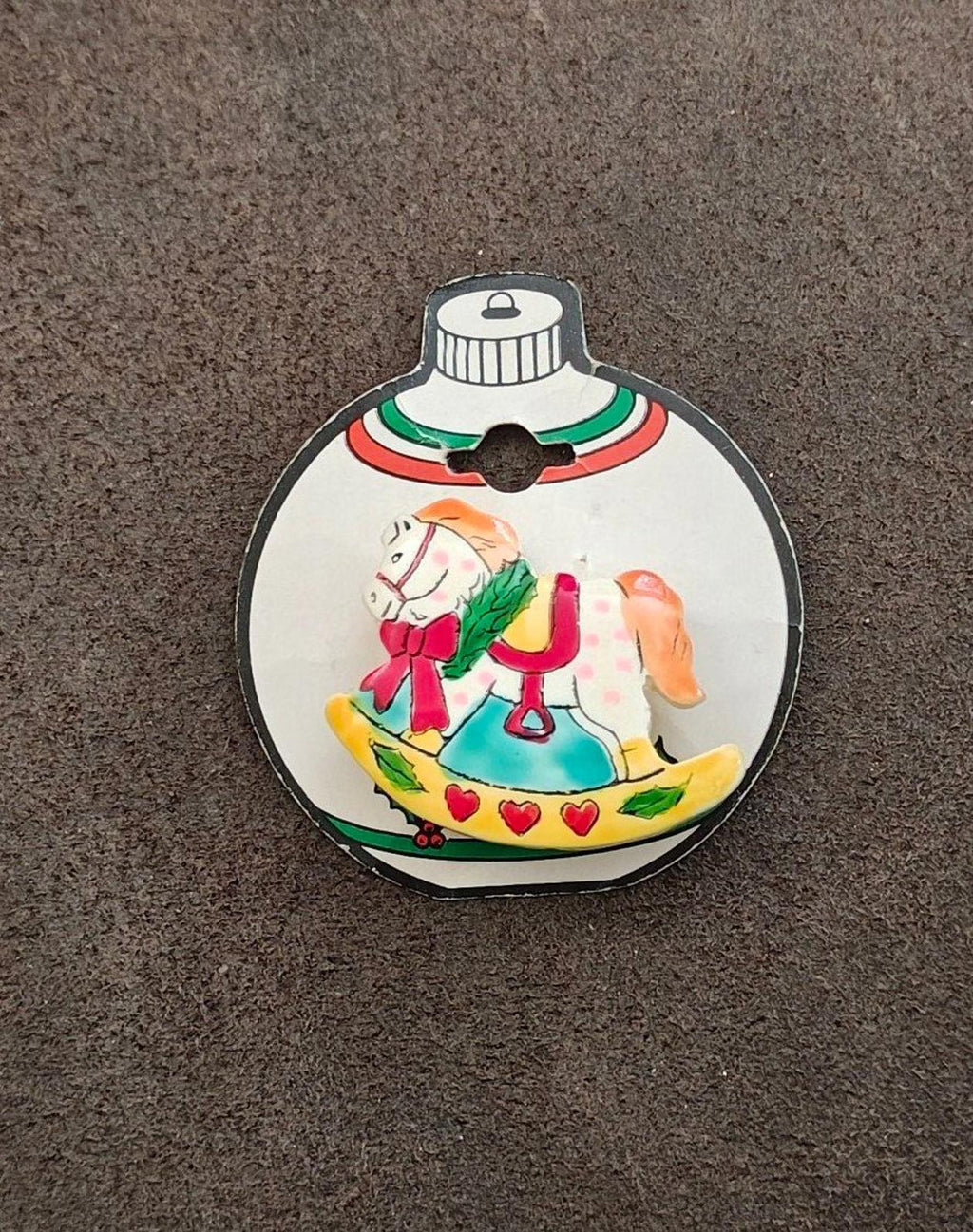 Rocking horse holiday pin brooch with heart garland border and bells