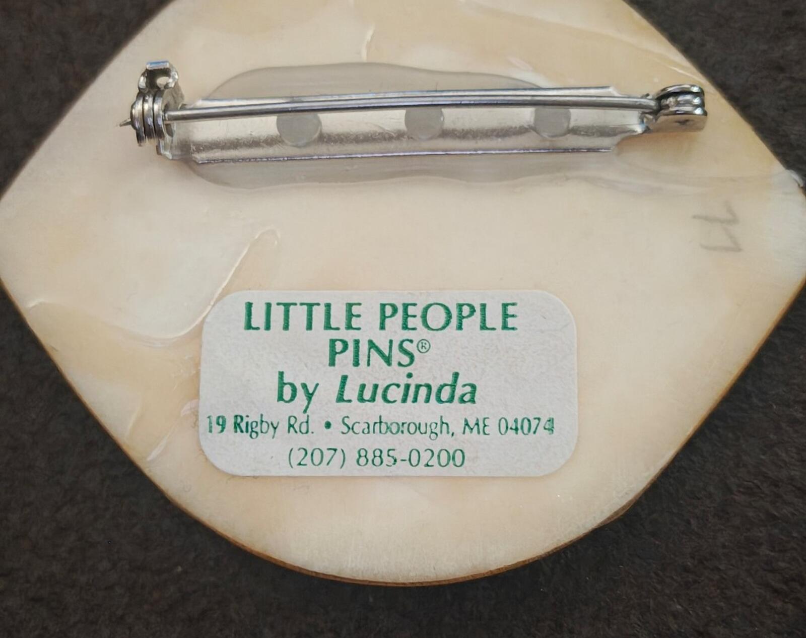 Pin back close-up with safety clasp and "LITTLE PEOPLE PINS by Lucinda" wording