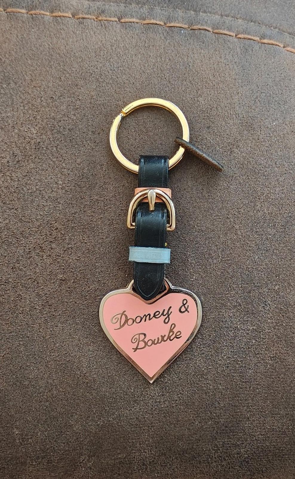 Dooney & Bourke heart keychain fob on gold ring, black strap with light blue accent