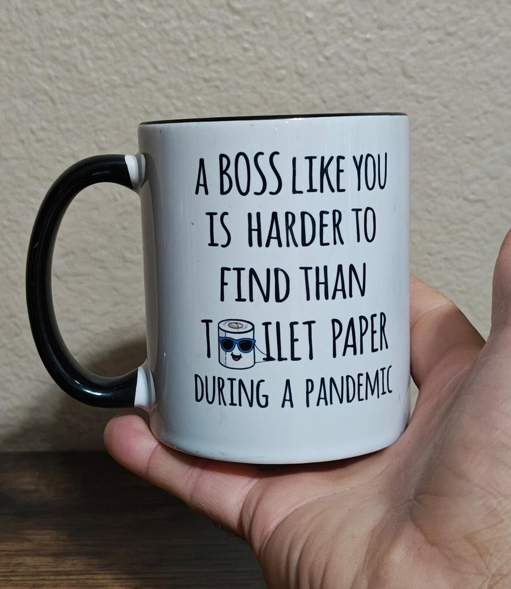 White mug with black handle, printed quote “A BOSS LIKE YOU IS HARDER TO FIND…”