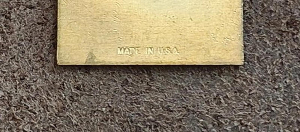 Close-up of the pin back text: “MADE IN USA”