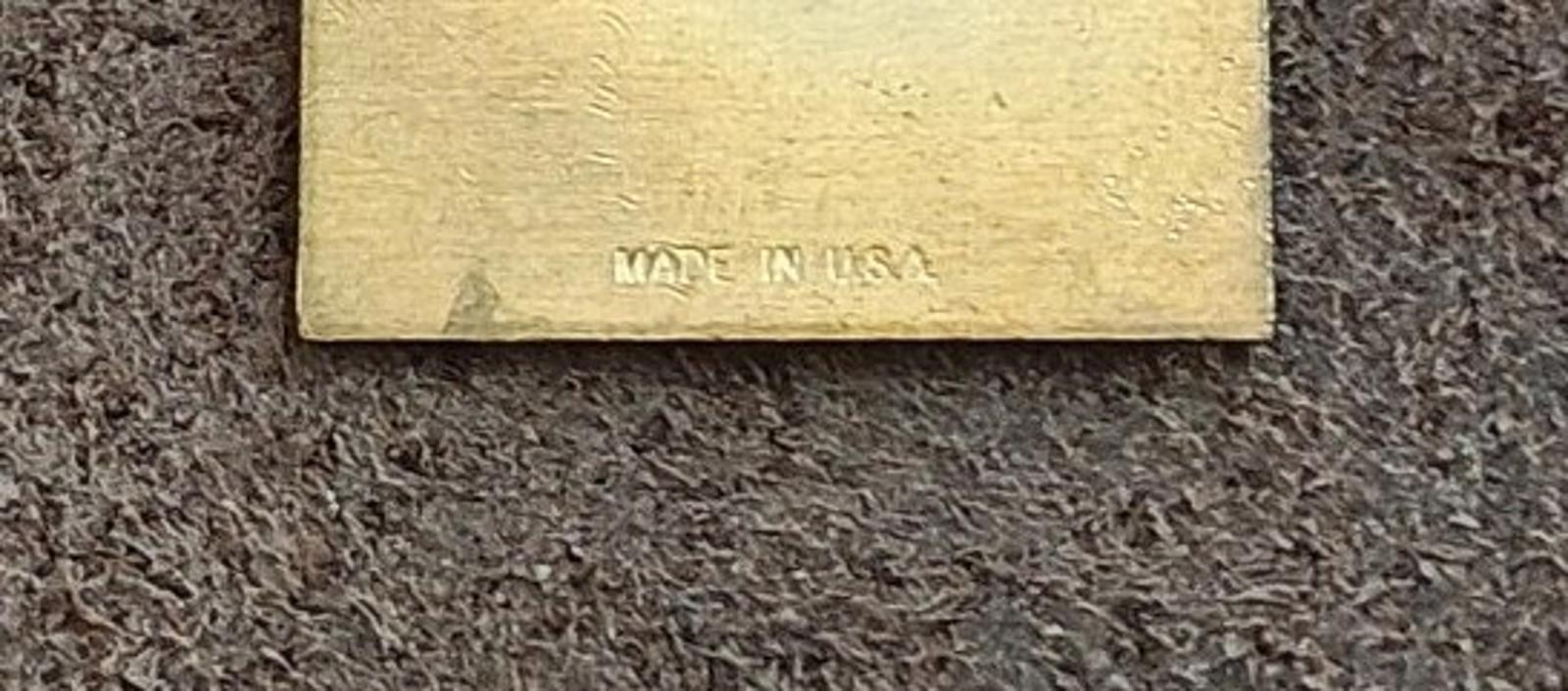 Close-up of the pin back text: “MADE IN USA”
