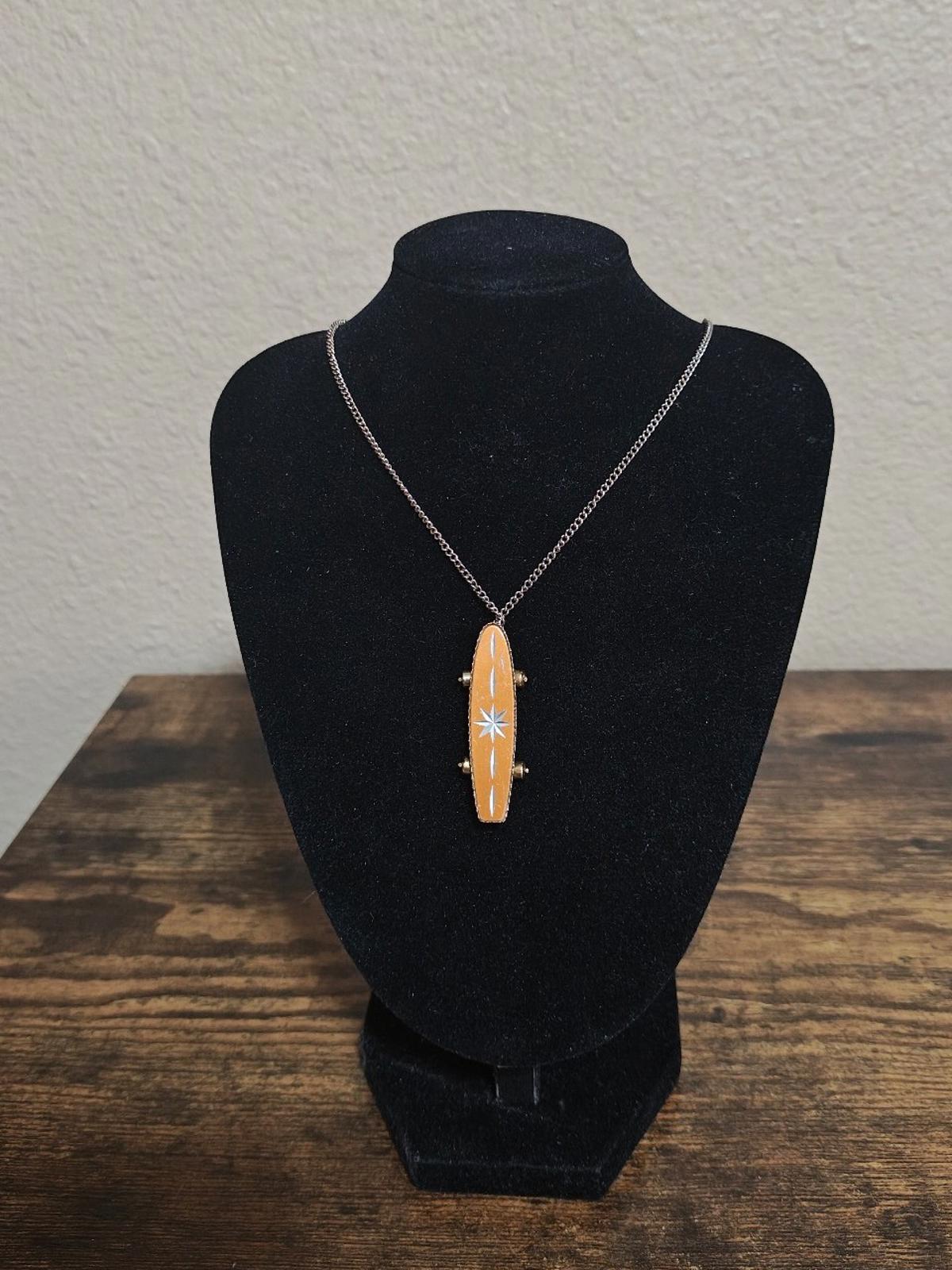 1980's MCM Starburst Skateboard Pendant Necklace with moveable wheels