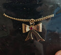 1980s 14k Gold Tone Bow Pendant Necklace With Vibrant Red Stone