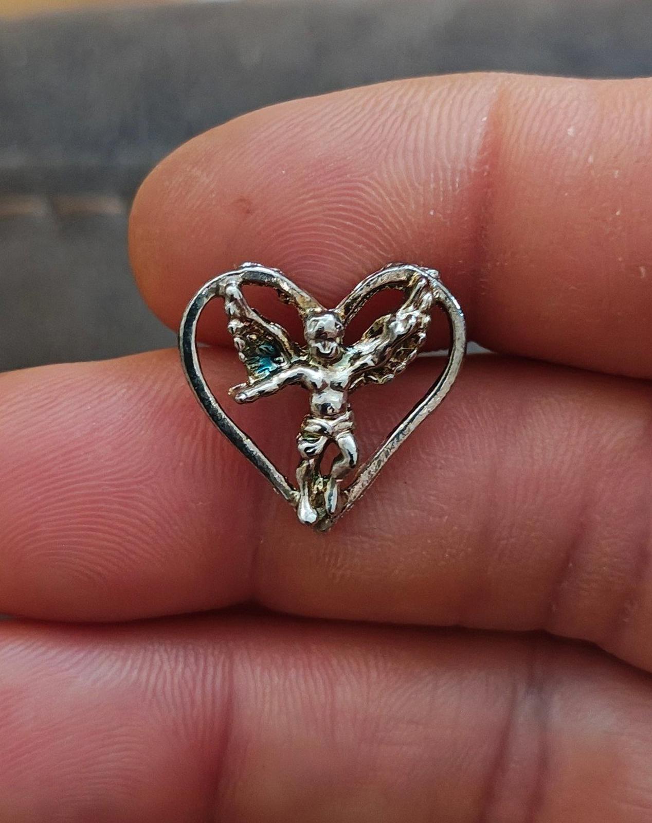 1980's Silver Tone Angel Inside A Heart Pin