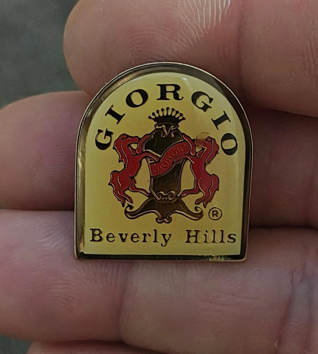 Gold-tone enamel crest pin with red and black lion, "Beverly Hills" text