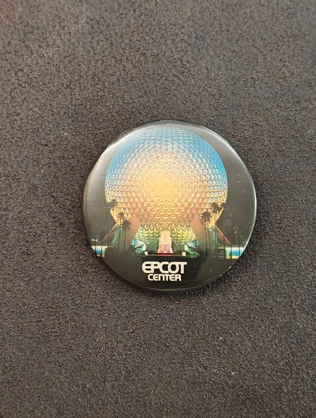Round EPCOT Center pinback showing globe scene with 'EPCOT CENTER' logo
