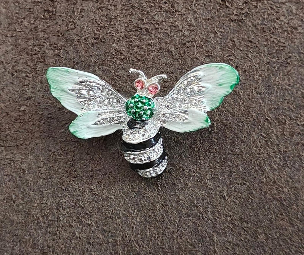 Bee enamel brooch with mint green wings and green center stones, pink rhinestone details