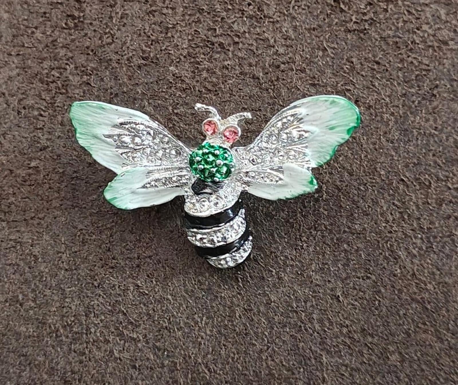 Bee enamel brooch with mint green wings and green center stones, pink rhinestone details