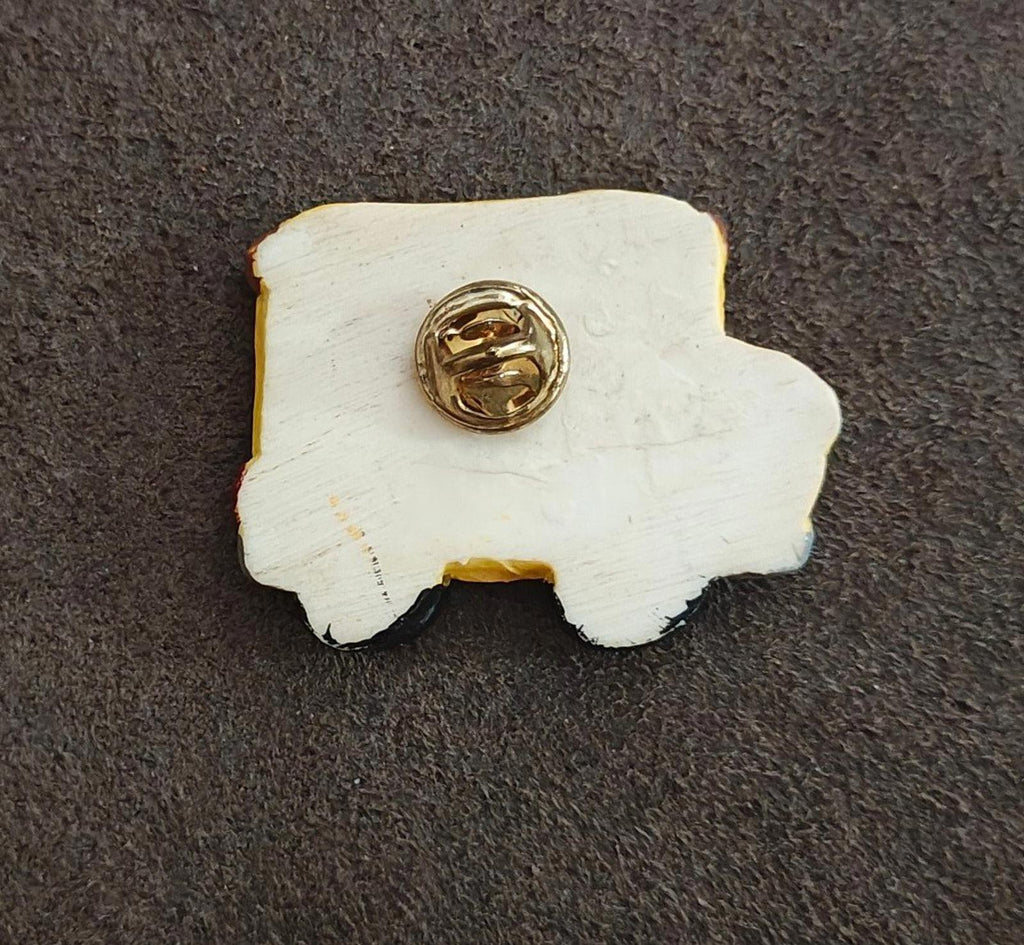 White resin backing school bus pin with gold-tone clasp and pin
