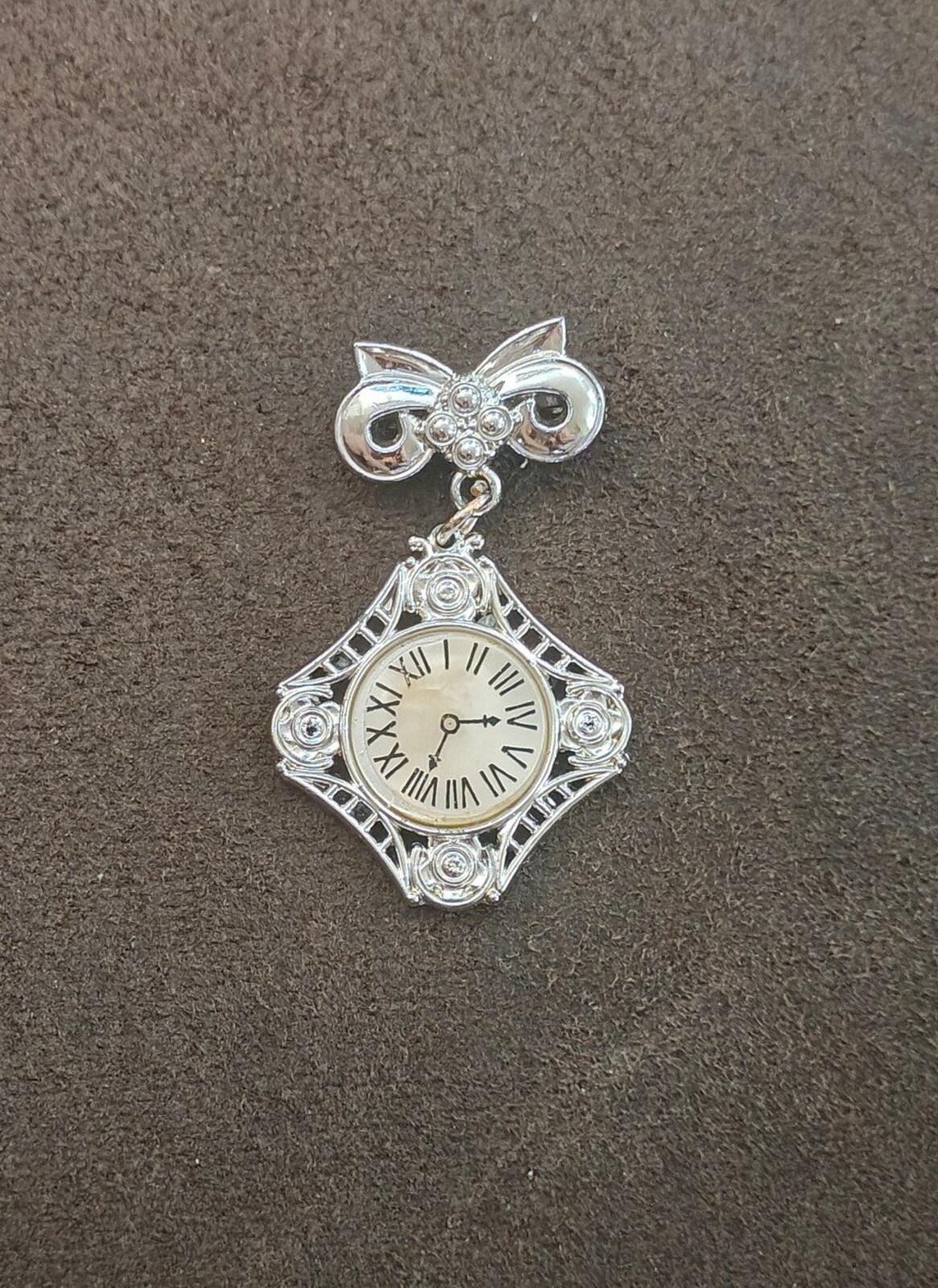 1980s Silver Tone Art Deco Style Bow Clock Motif Dangle Brooch