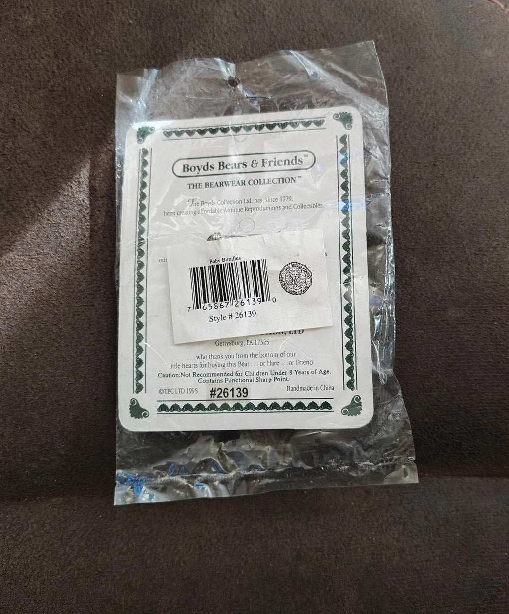 Back label of Bearwear teddy bear brooch retail package with barcode and style