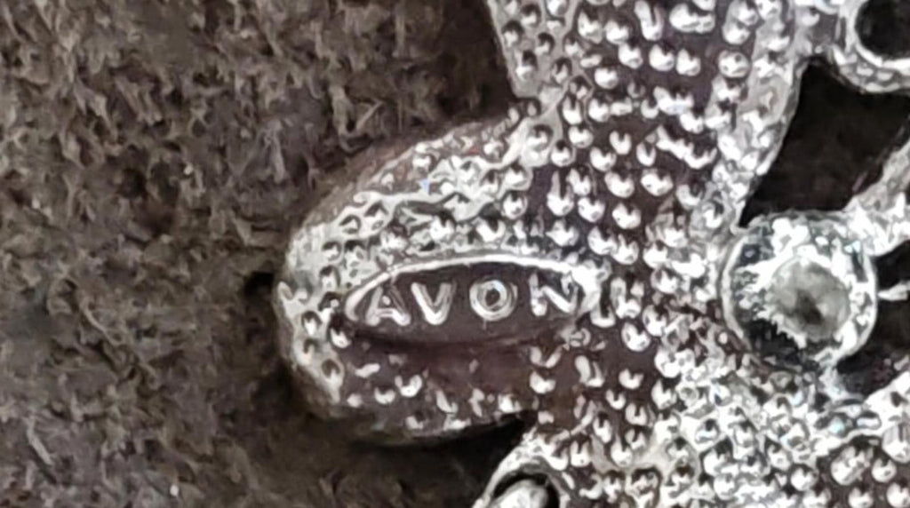 Silver-tone AVON stamped butterfly pin back with teal teardrop rivet