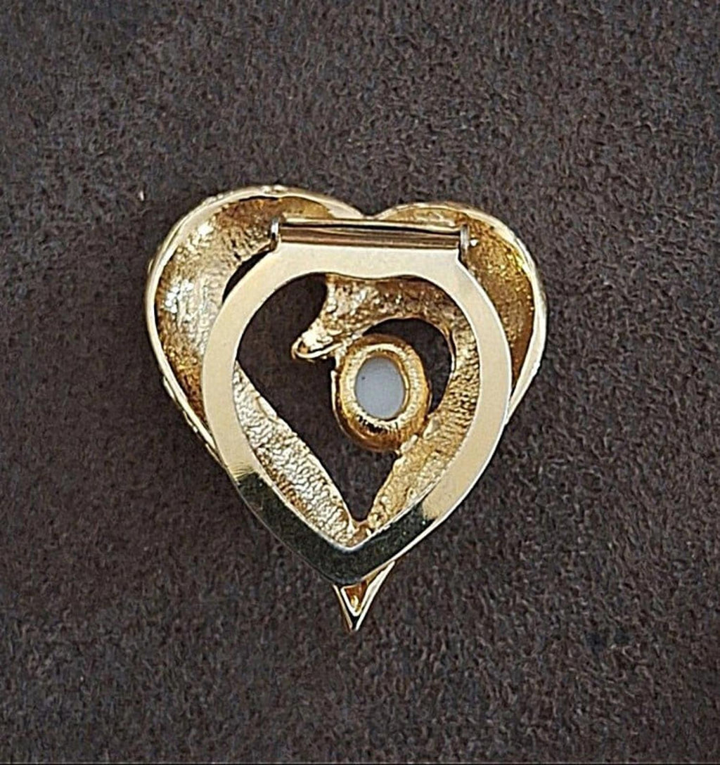 Back of gold tone heart scarf clip with open hinged frame