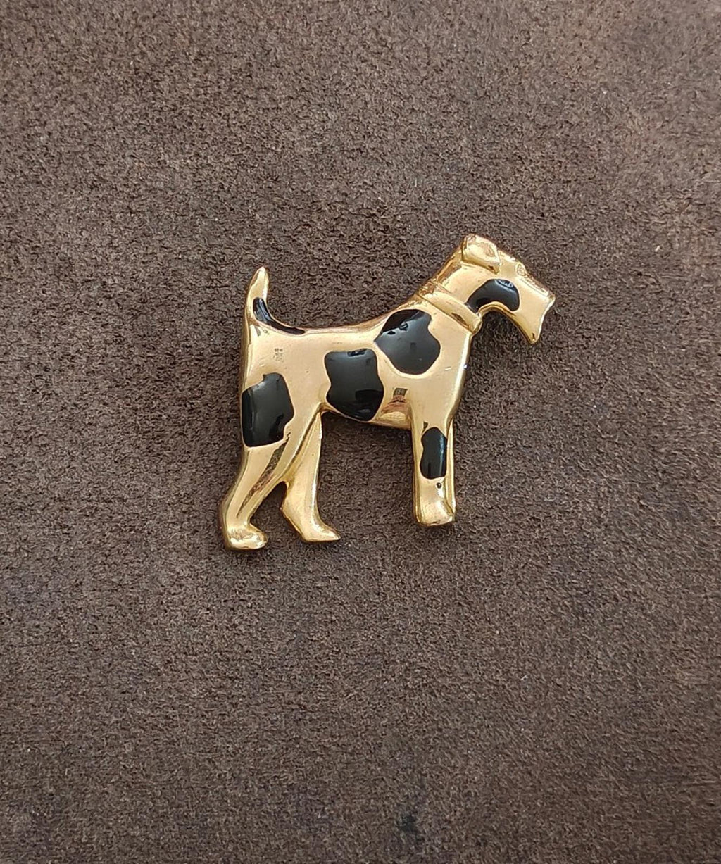 Gold-tone dog brooch, side view, black enamel spots and rhinestone-like eye