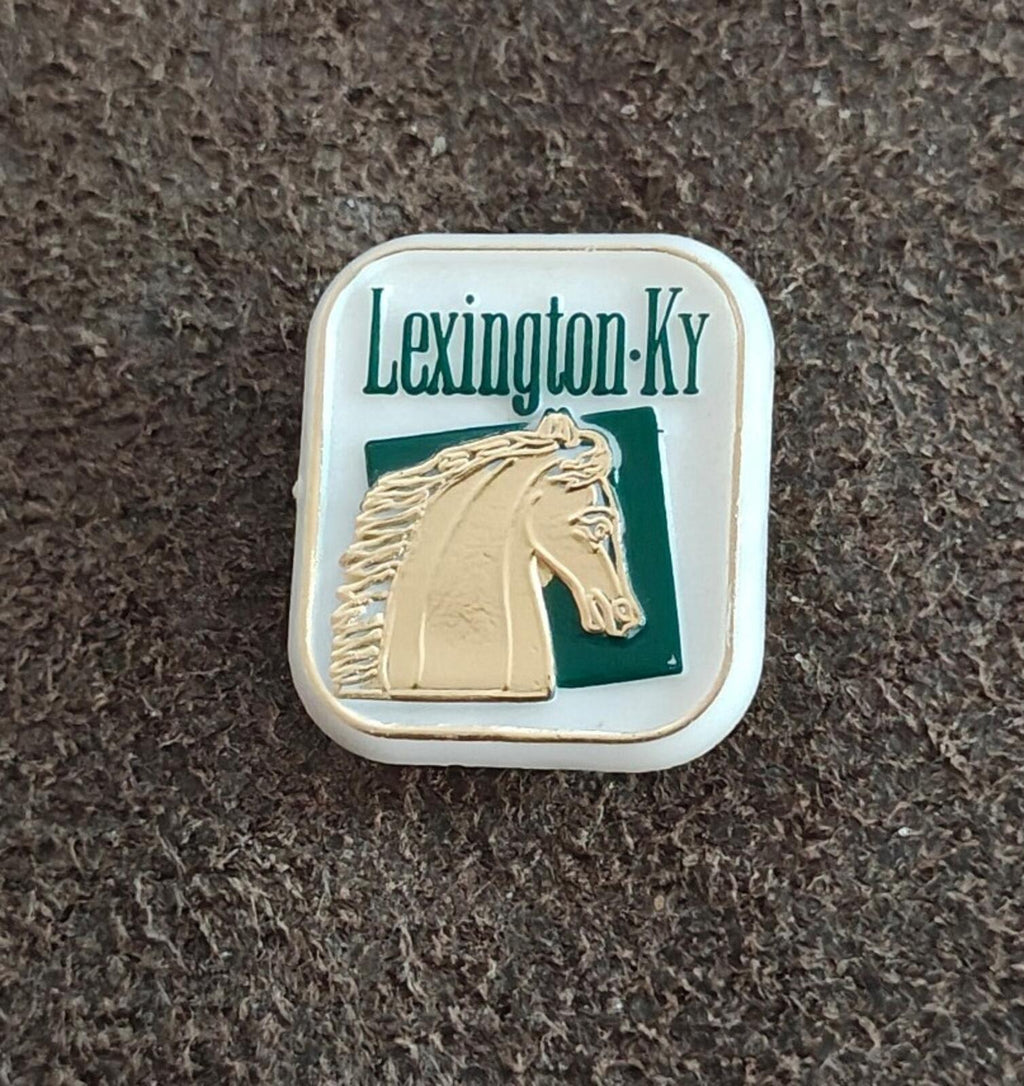 Lexington-KY horse travel souvenir pin, green field and beige horse emblem