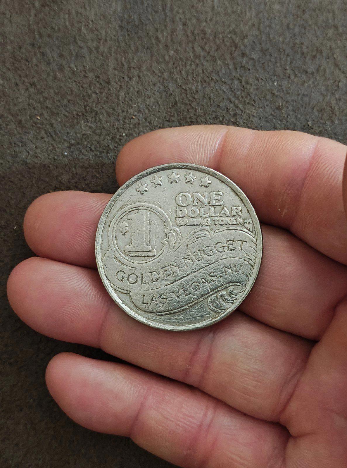Silver Golden Nugget one-dollar slot token with ONE DOLLAR and LAS VEGAS text.