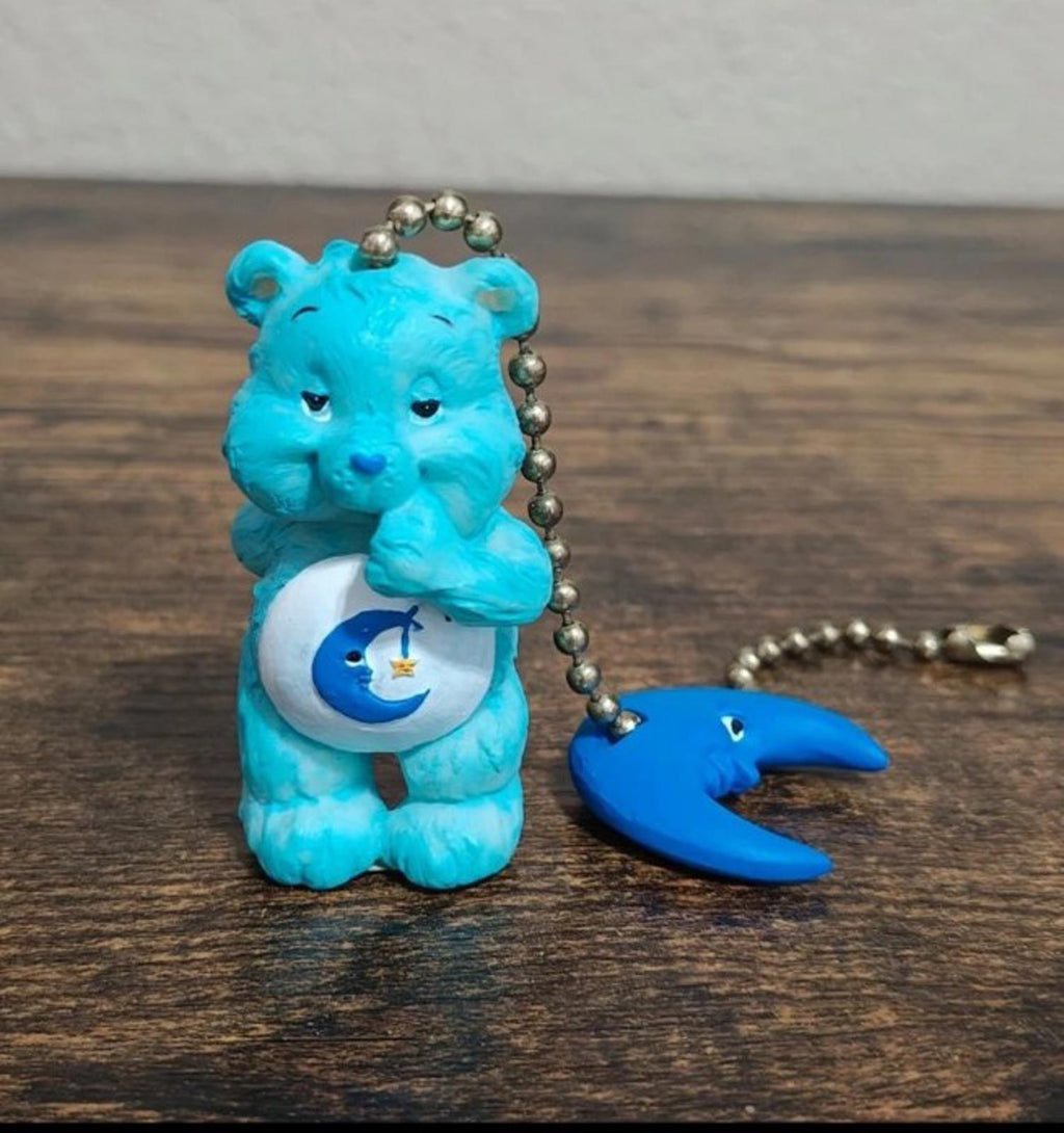 Blue bear figure fan pull with keyring clasp, crescent moon charm, and bead chain