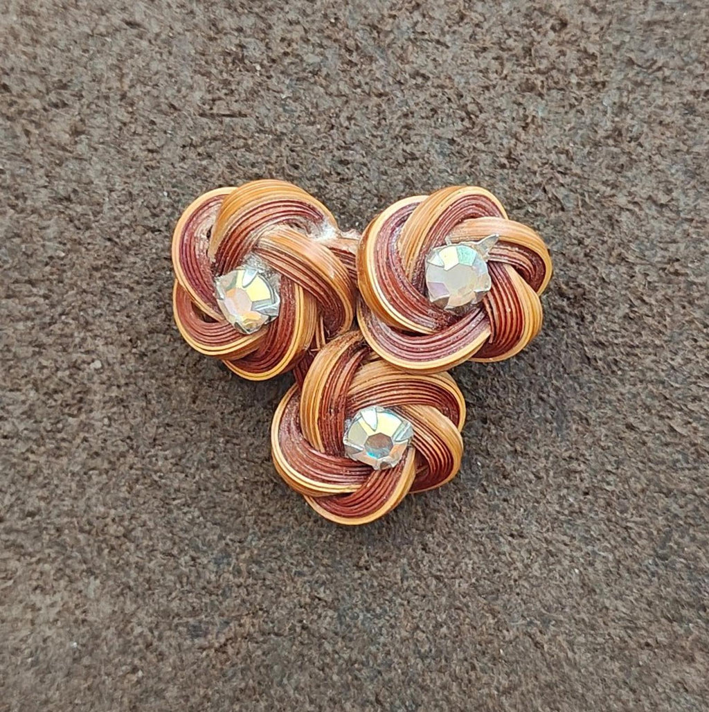 Three-flower bamboo rosette brooch pin with three glittering rhinestones in brown coilwork