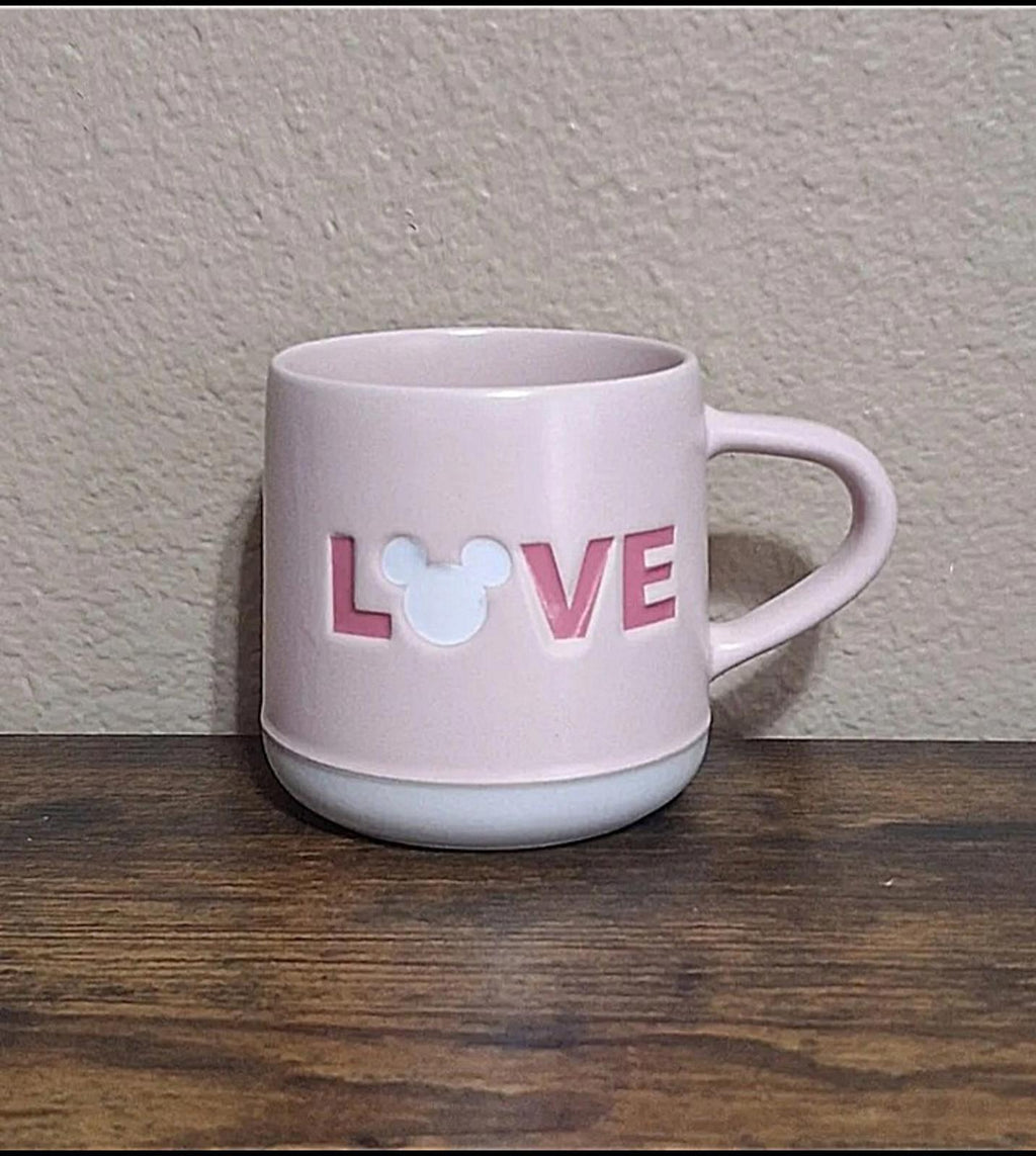 Pink stoneware mug with LOVE letters and heart mouse graphic