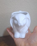White ceramic bunny mug with embossed bunny face and open top