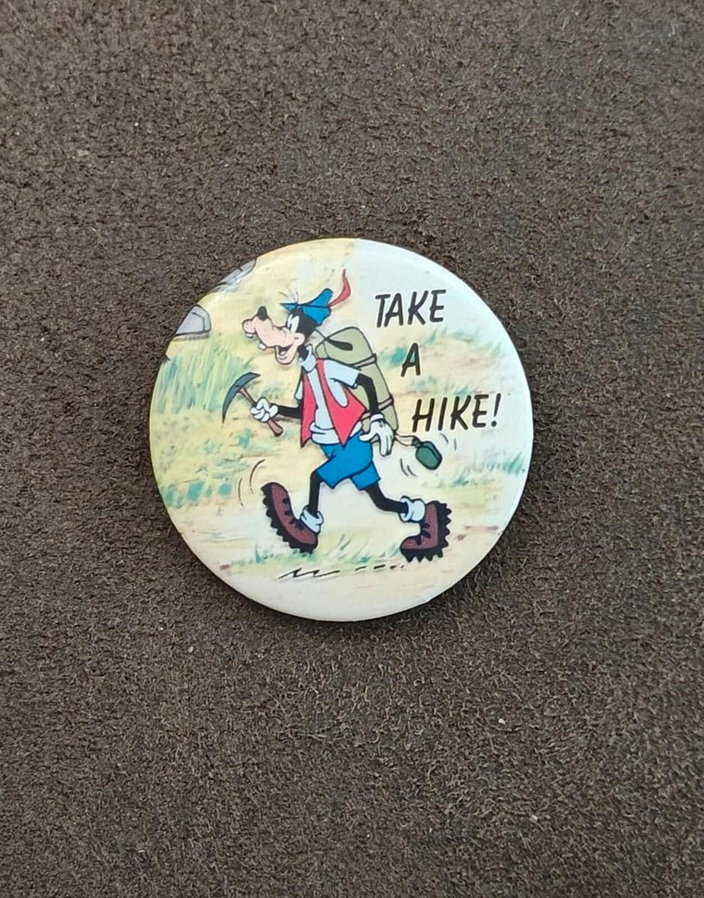 Goofy pinback button, “Take a Hike!” lettering with Goofy walking hiking scene