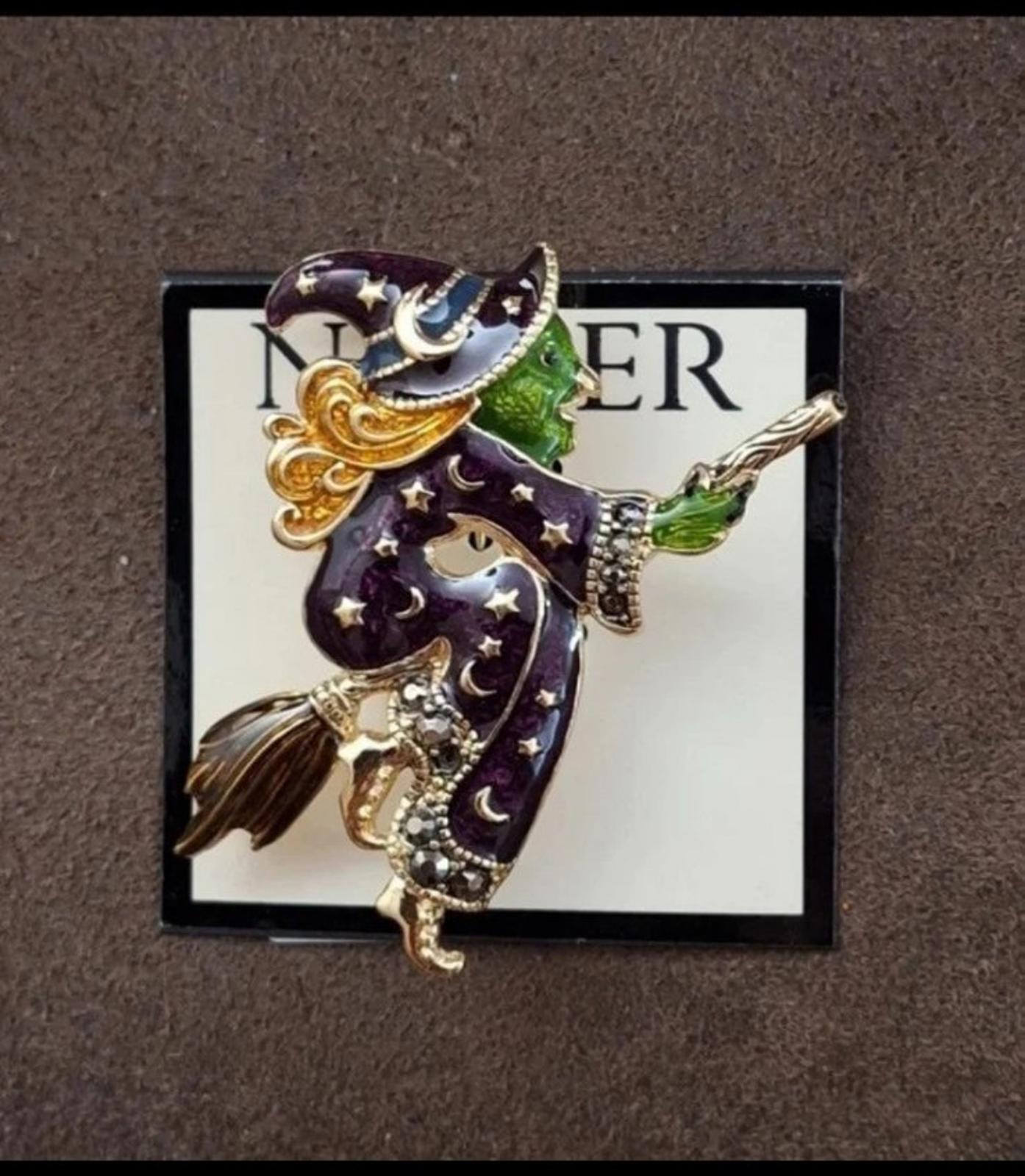 Gold-tone witch enamel pin brooch with dark purple details, green broom, star accents
