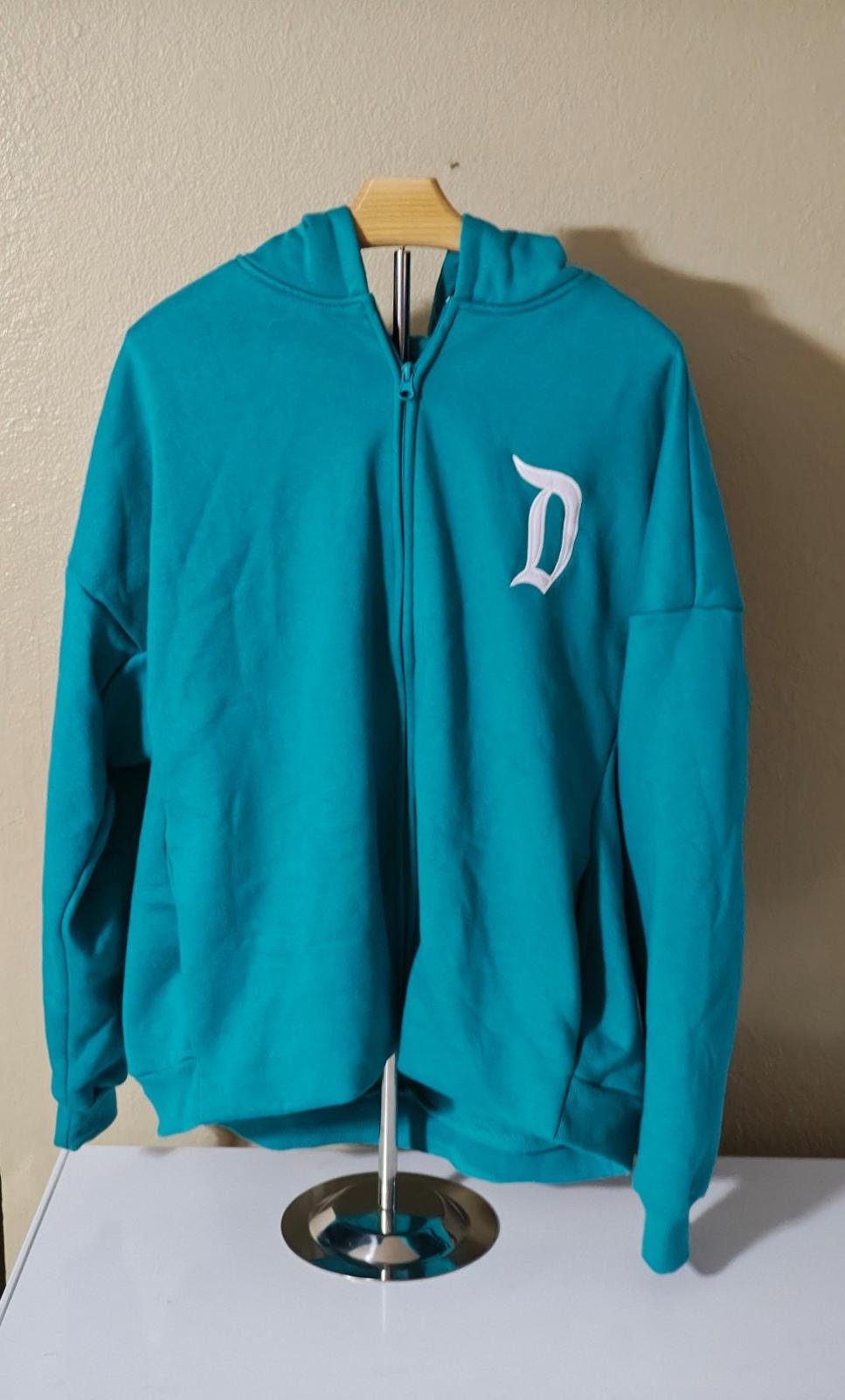 Teal zip-up hoodie with hood and small white D logo on the chest