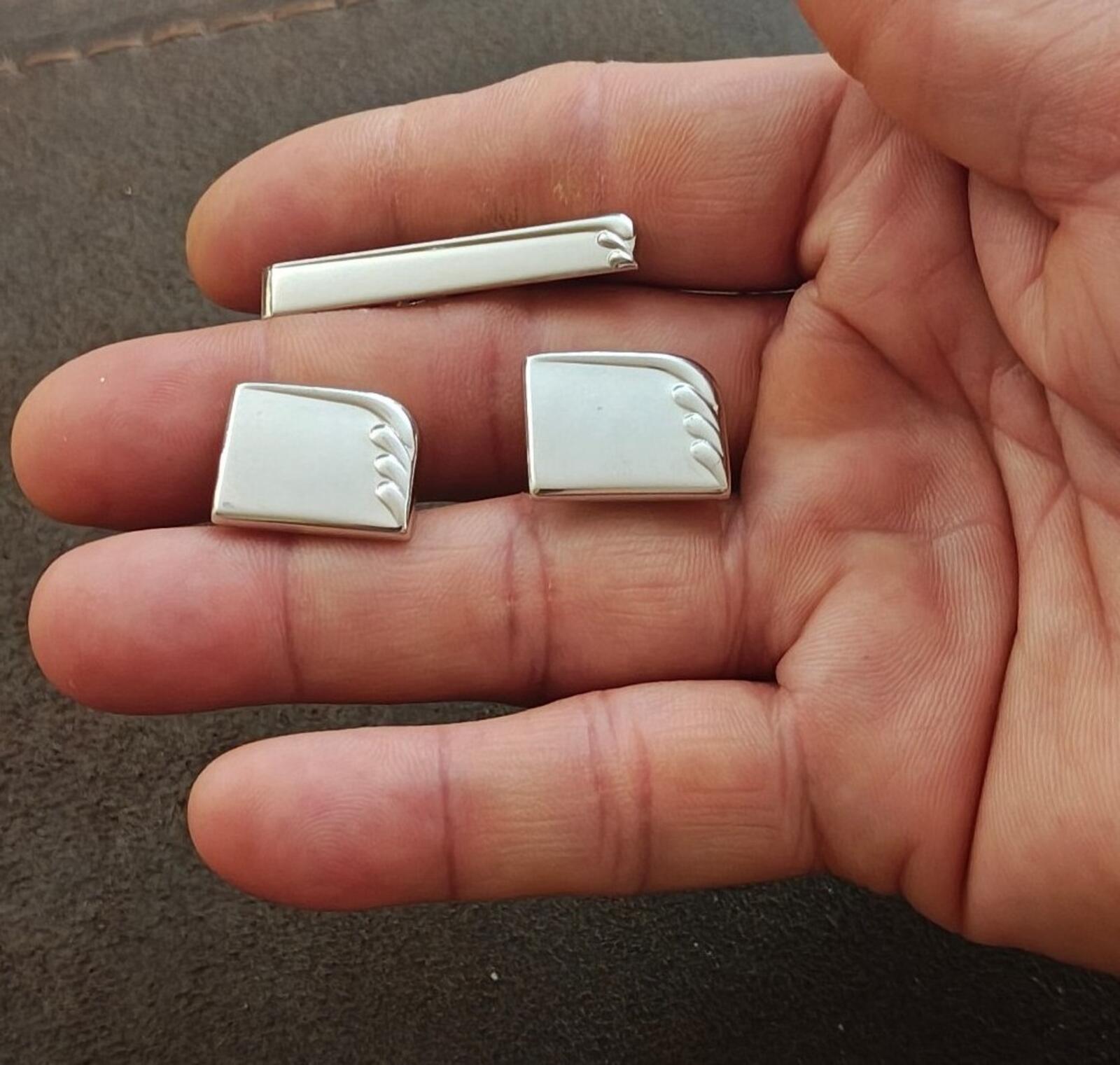 Silver tie bar and cufflinks set showing rectangular panels with art-deco ridged detailing
