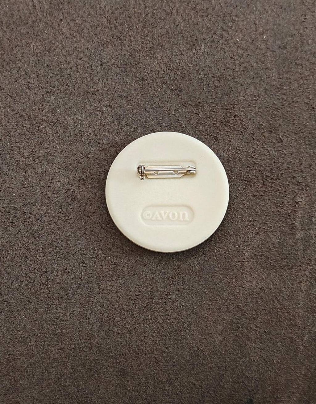 Porcelain disc brooch pin back, white with silver bar pin and Avon mark
