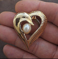 Gold tone heart scarf clip with faux pearl center detail