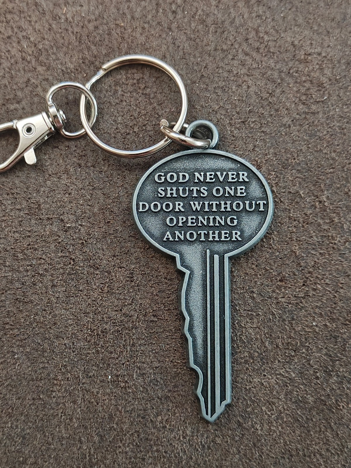 "God never shuts one door without opening another." Cast Metal Keychain